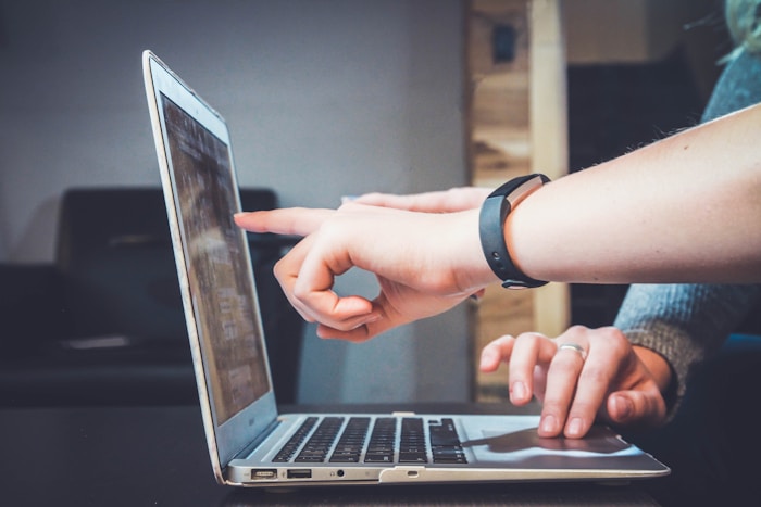 Student attending a live online training session on laptop